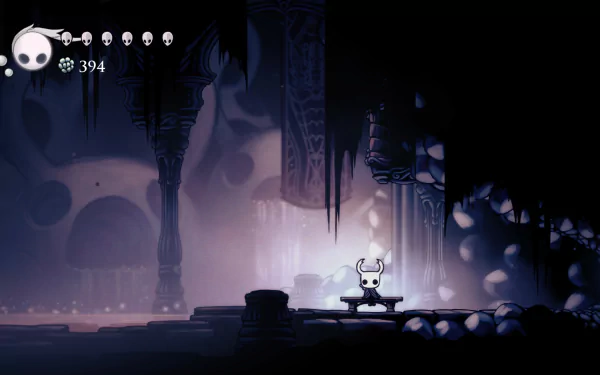 4K Ultra HD Hollow Knight video game wallpaper featuring the protagonist in a dark, atmospheric cavern with detailed shadows and glowing ambient light.