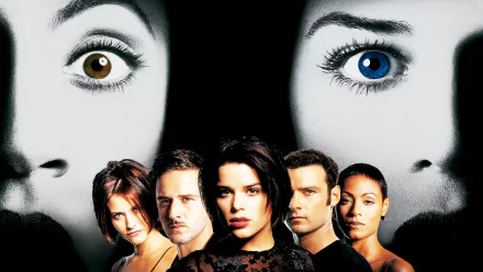 HD PC desktop wallpaper/background: Scream 2 movie poster with twin Ghostface mask faces looming above the central ensemble cast on a stark black backdrop.