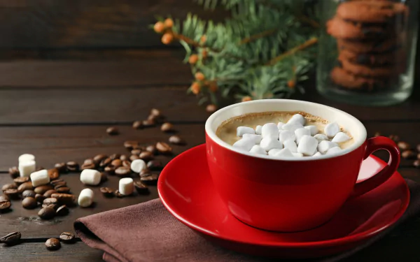 A 4K Ultra HD desktop wallpaper featuring a red cup filled with hot chocolate topped with marshmallows, surrounded by coffee beans and cookies on a wooden table.