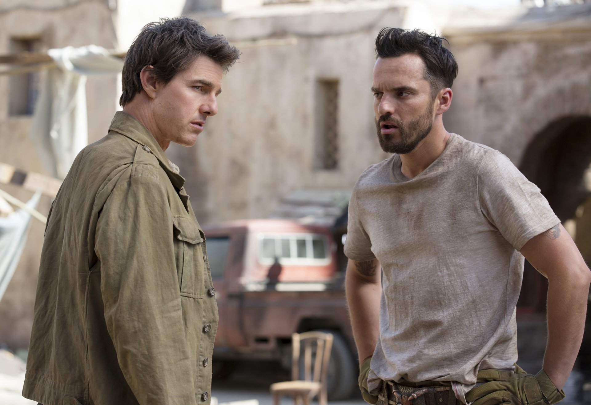 Tom Cruise in a scene from The Mummy (2017), standing and conversing with another character. HD desktop wallpaper and background.