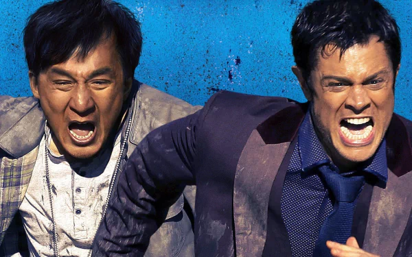 HD desktop wallpaper featuring Jackie Chan and a co-star from the 2016 movie Skiptrace, directed by Renny Harlin. Both characters are captured in an intense scene with vivid expressions against a blue background.