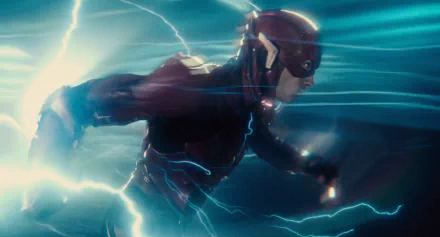 Ezra Miller as Barry Allen, also known as the Flash, in the Justice League movie. The HD wallpaper captures the Flash sprinting through a burst of electric energy.