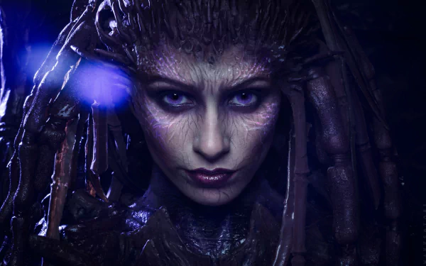 HD PC desktop wallpaper featuring a detailed woman cosplay of Sarah Kerrigan from Starcraft II, showcasing her intense expression and intricate Zerg-inspired design.