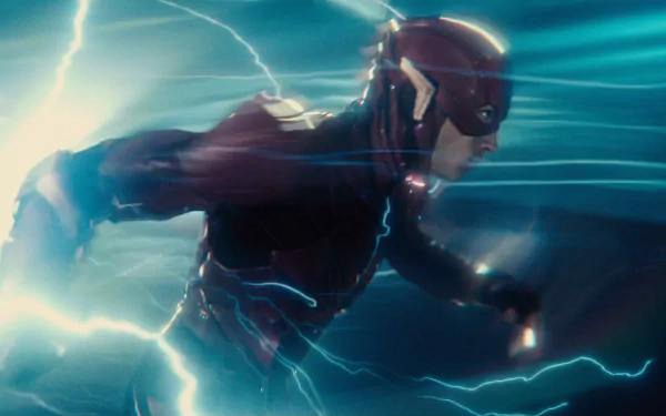 Ezra Miller as Barry Allen, also known as the Flash, in the Justice League movie. The HD wallpaper captures the Flash sprinting through a burst of electric energy.