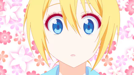 HD PC desktop wallpaper featuring Chitoge Kirisaki from the anime Nisekoi, with her wide blue eyes and blonde hair against a pink floral background.