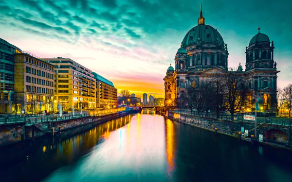 HD desktop wallpaper featuring the illuminated Berlin Cathedral at night, reflecting over the river in Berlin, Germany under a vibrant sky.