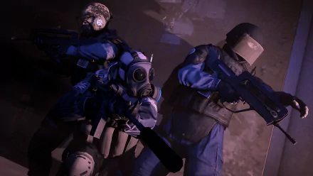 Three tactical operatives in combat gear from the video game Counter-Strike: Global Offensive are seen in action. This HD desktop wallpaper captures the intense atmosphere and strategic gameplay.
