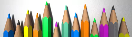 3D HD PC desktop wallpaper photography: close-up of colorful sharpened pencil tips (green, teal, blue, orange, purple) arranged like a skyline on a white background.