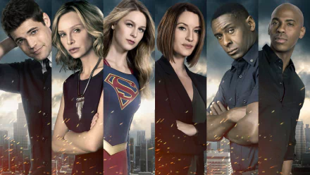 HD desktop wallpaper featuring main characters from the TV show Supergirl, including Cat Grant, Kara Danvers, Jimmy Olsen, and others in a city backdrop.