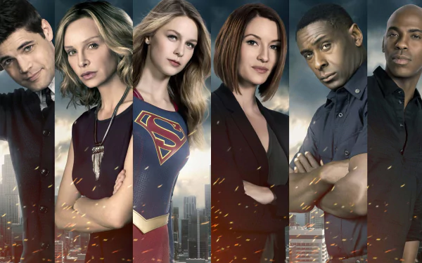 HD desktop wallpaper featuring main characters from the TV show Supergirl, including Cat Grant, Kara Danvers, Jimmy Olsen, and others in a city backdrop.