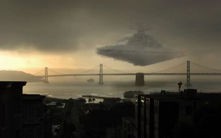 HD desktop wallpaper featuring San Francisco's Bay Bridge with a Star Wars Star Destroyer hovering above the foggy bay. A cityscape at dawn enhances the sci-fi movie ambiance.