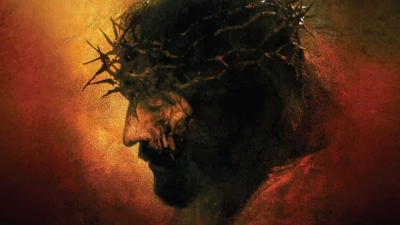 HD PC desktop wallpaper featuring a dramatic close-up of Jesus Christ wearing a crown of thorns from the movie The Passion of the Christ.