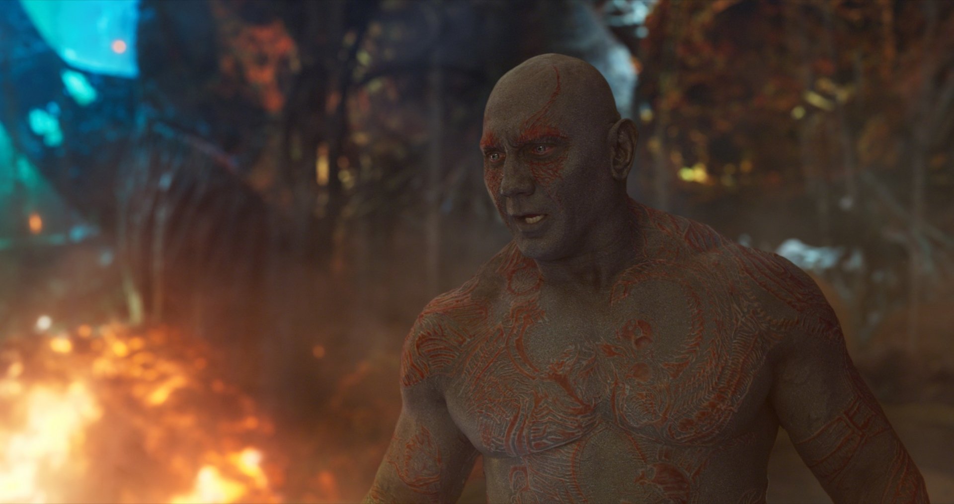 HD desktop wallpaper featuring Drax The Destroyer, portrayed by Dave Bautista, from the movie Guardians of the Galaxy Vol. 2 in a fiery, intense scene.