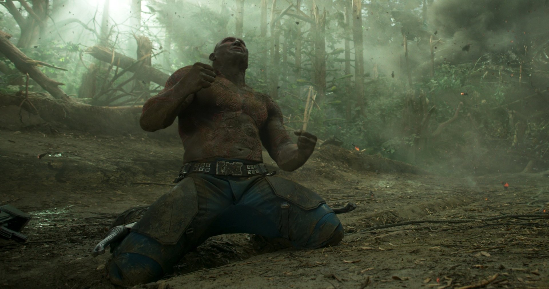 HD PC desktop wallpaper featuring Drax The Destroyer, portrayed by Dave Bautista, from the movie Guardians of the Galaxy Vol. 2, in a dynamic forest scene.