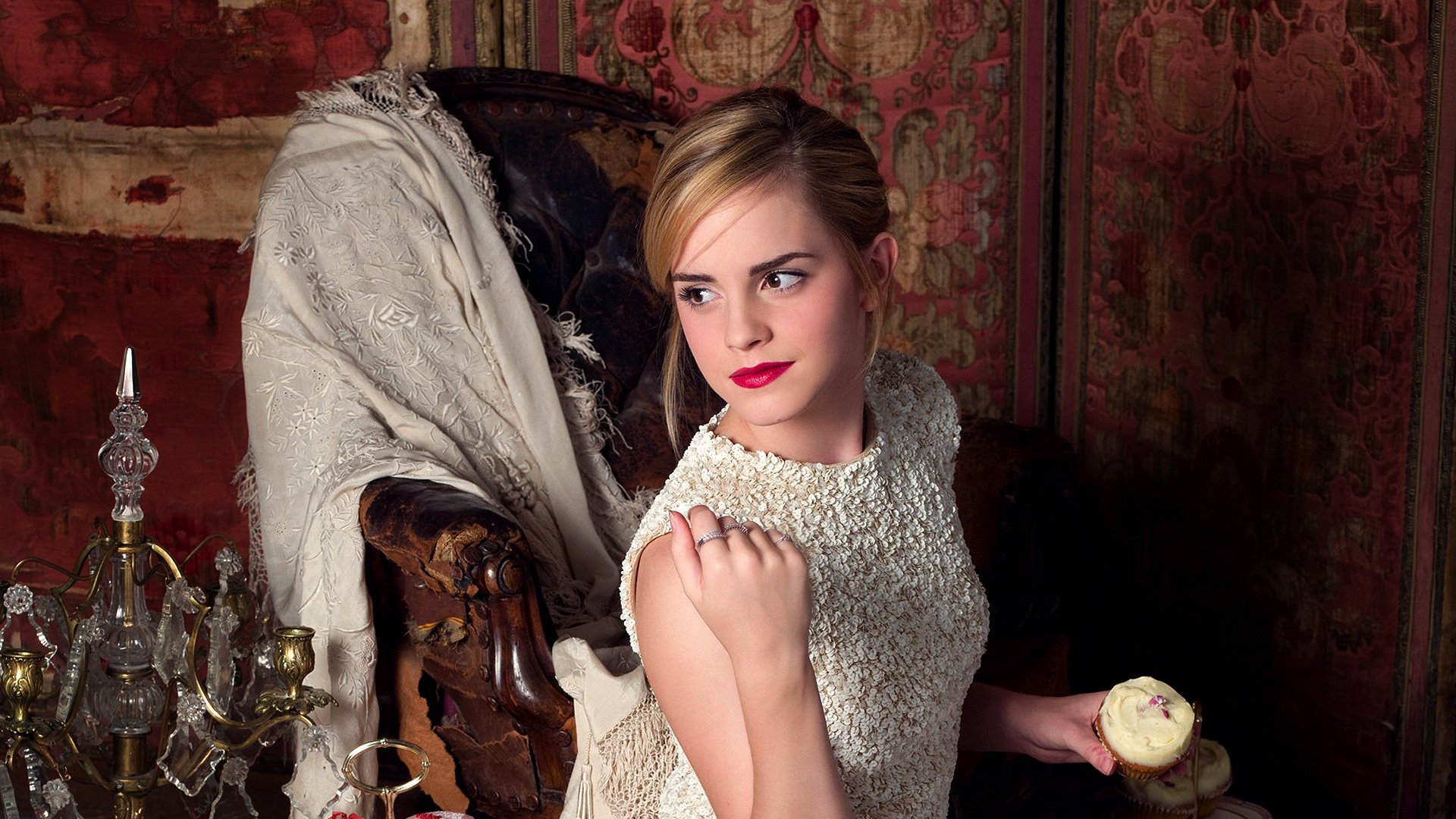 Emma Watson showcases elegance in this HD desktop wallpaper, featuring her in a vintage setting, wearing a stylish outfit and a confident expression.