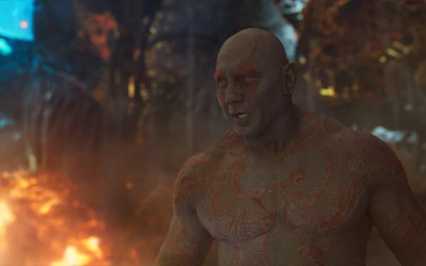 HD desktop wallpaper featuring Drax The Destroyer, portrayed by Dave Bautista, from the movie Guardians of the Galaxy Vol. 2 in a fiery, intense scene.