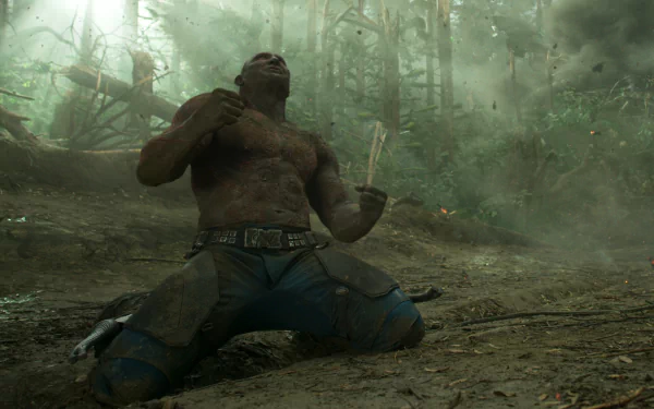 HD PC desktop wallpaper featuring Drax The Destroyer, portrayed by Dave Bautista, from the movie Guardians of the Galaxy Vol. 2, in a dynamic forest scene.