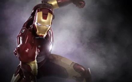 HD PC desktop wallpaper featuring Iron Man in action pose, inspired by Tony Stark from the movie series, with a smoky, dramatic background.