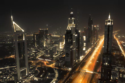 4K Ultra HD time-lapse image of Dubai’s skyline at night, showcasing illuminated skyscrapers and busy highways in the United Arab Emirates cityscape.