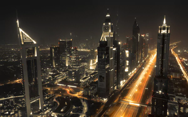 4K Ultra HD time-lapse image of Dubai’s skyline at night, showcasing illuminated skyscrapers and busy highways in the United Arab Emirates cityscape.