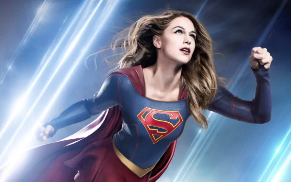 HD desktop wallpaper of Melissa Benoist as Supergirl, flying with a determined expression against a dynamic background from the TV show Supergirl.