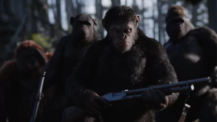 HD desktop wallpaper featuring Caesar and other apes from the movie War For The Planet Of The Apes, armed and standing together in a forest setting.