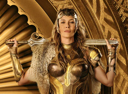 HD desktop wallpaper featuring Robin Wright as General Antiope from the movie Wonder Woman, showcasing her in golden armor with a sword against a detailed golden background.