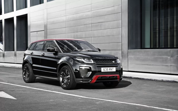 Black Land Rover Range Rover Evoque SUV parked on an urban street with red trim — 4K Ultra HD PC desktop wallpaper/background.