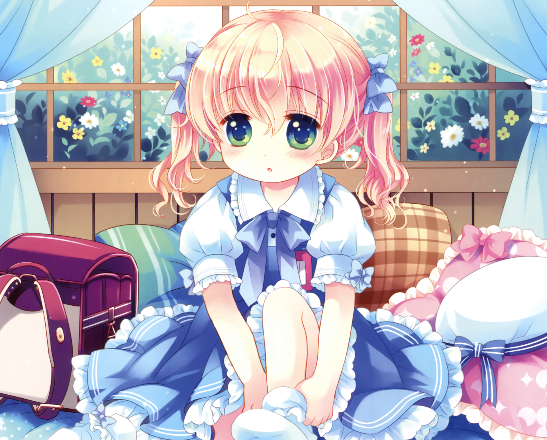 Anime girl with blonde twintails and green eyes sits indoors wearing socks and a blue dress, surrounded by flowers, ribbons, and a school bag in an HD desktop wallpaper.