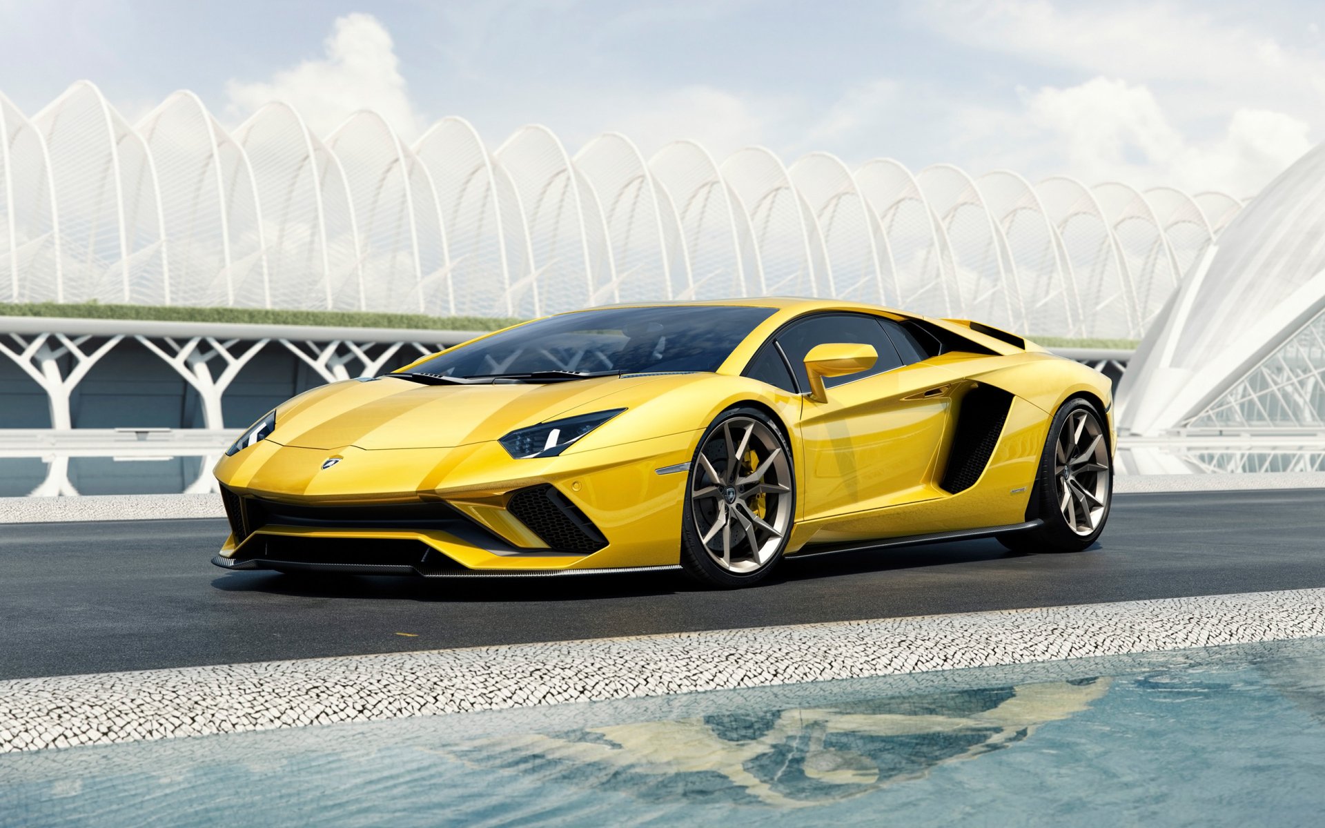 Yellow Lamborghini Aventador S supercar parked by a modern white bridge, 2K Quad HD PC desktop wallpaper/background.