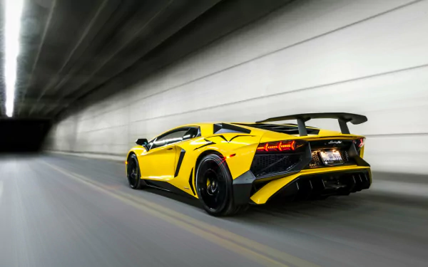 Yellow Lamborghini Aventador LP750-4 SV supercar speeding through a tunnel, rear three-quarter view — HD desktop wallpaper of the Lamborghini Aventador SV.