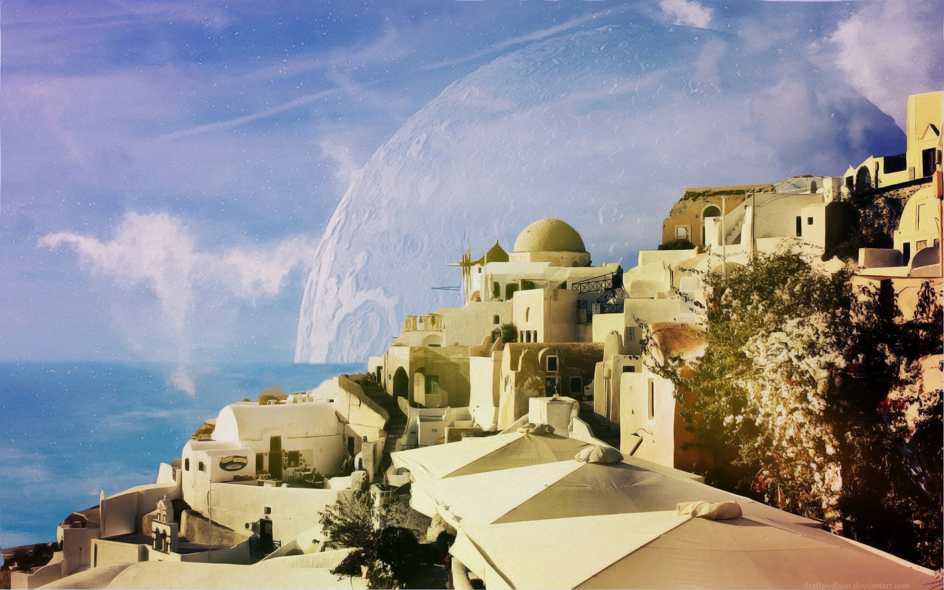 Artistic HD desktop wallpaper featuring a serene whitewashed village by the sea, with a celestial backdrop, blending man-made architecture with natural beauty.