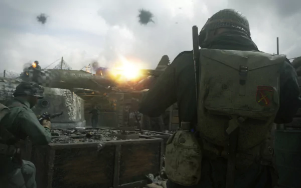 HD desktop wallpaper featuring intense action from Call of Duty: WWII, showcasing soldiers in combat with explosions and gunfire.