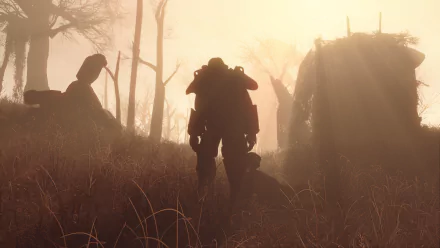 HD desktop wallpaper of Fallout 4 showing a silhouetted character in power armor walking through a foggy, post-apocalyptic landscape with bare trees and tall grass.