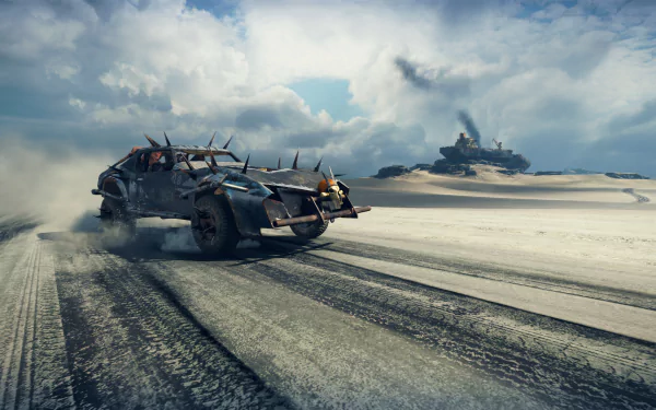 4K Ultra HD PC desktop wallpaper: Mad Max video game armored car racing across a windswept desert, kicking sand, with a second vehicle on distant dunes under a stormy sky.