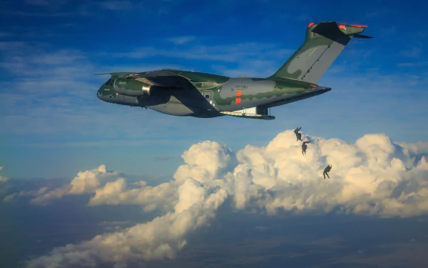Embraer KC-390 military transport aircraft flies above clouds as parachutists exit, captured in a high-definition desktop wallpaper scene.