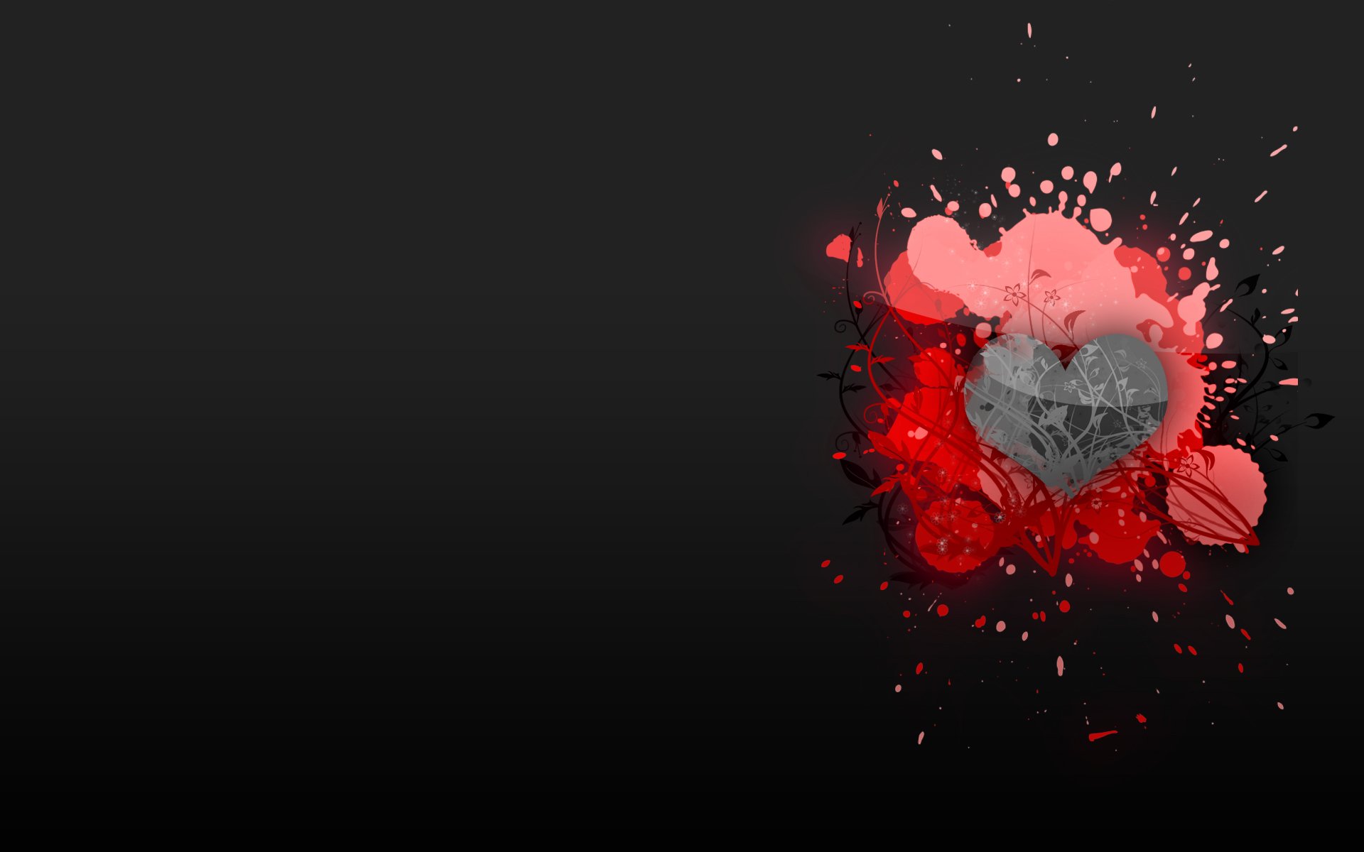 An artistic HD desktop wallpaper featuring a heart design surrounded by vibrant red splashes, evoking themes of love and creativity against a sleek black background.