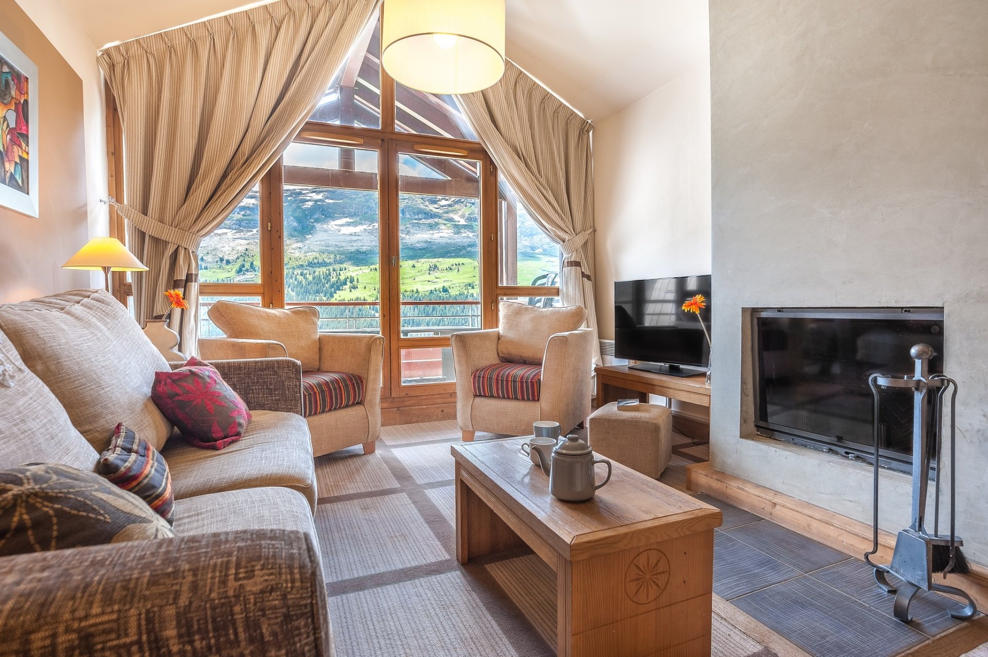 HD PC desktop wallpaper/background: bright living room interior with furniture — sofa, armchairs, coffee table, TV and fireplace, large window with drapes (man-made room).