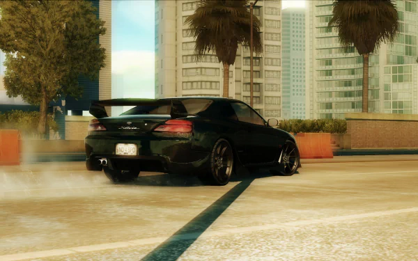 HD PC desktop wallpaper from Need for Speed: Undercover showing a black sports car drifting on a sunlit urban street lined with palm trees and glass high-rises.