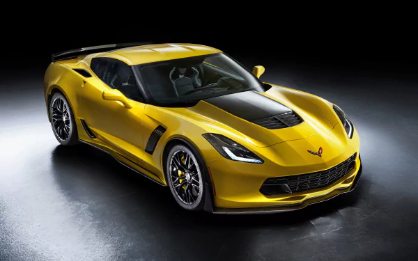 Yellow Chevrolet Corvette C7.R grand tourer race car showcased in 4K Ultra HD as a sleek, high-performance vehicle against a dark background.