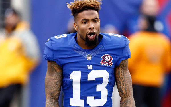 HD wallpaper of New York Giants player, wearing number 13, on the field.