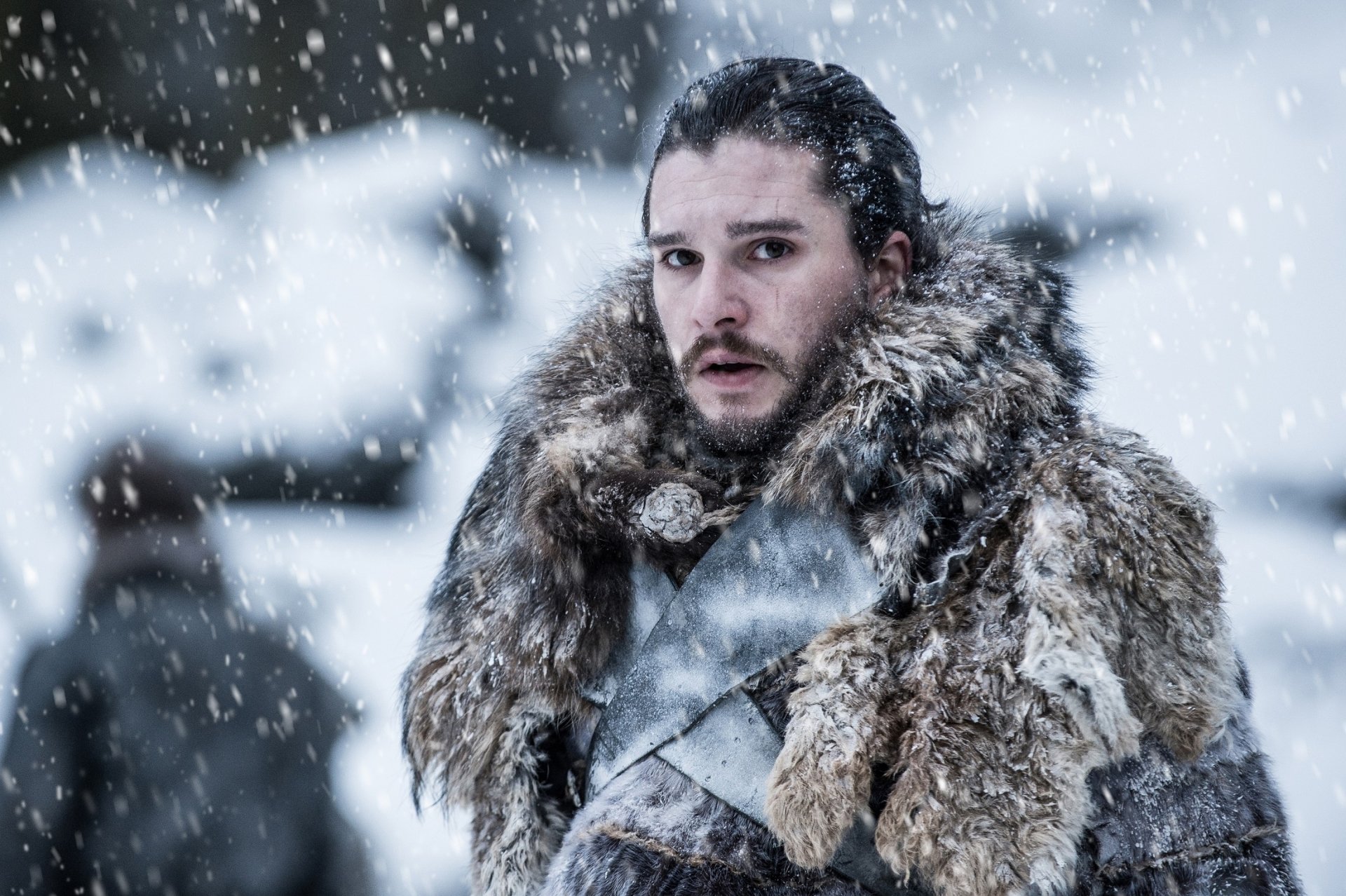 HD PC desktop wallpaper featuring Kit Harington as Jon Snow from the TV show Game of Thrones in a snowy, winter setting.