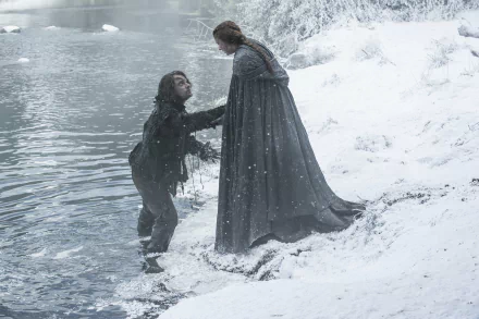 Game of Thrones 4K desktop wallpaper: Sansa Stark helps Theon Greyjoy from an icy river on a snowy shoreline, both in medieval cloaks as snow falls around them.