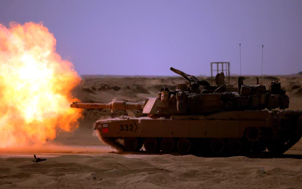 HD desktop wallpaper of an M1 Abrams tank firing in a sandy desert explosion, showcasing military power and armored vehicle strength.