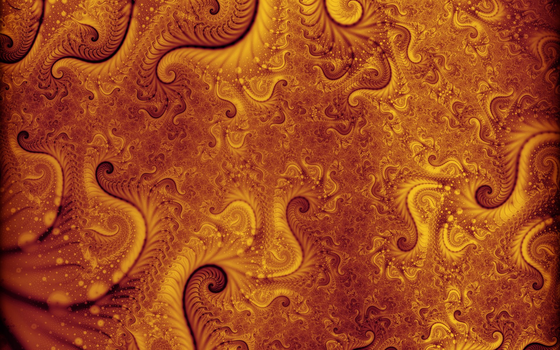 A vibrant psychedelic fractal design in shades of orange and yellow, featuring intricate swirling patterns, rendered as an HD PC desktop wallpaper and background.