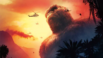 A HD desktop wallpaper from the movie Kong: Skull Island features a giant gorilla with helicopters flying around it against a dramatic sunset backdrop.