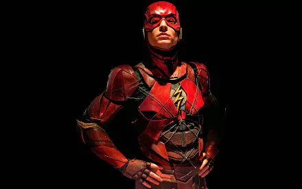 HD desktop wallpaper featuring Ezra Miller as The Flash from the Justice League movie, showcasing the red, lightning-themed superhero suit against a dark background.