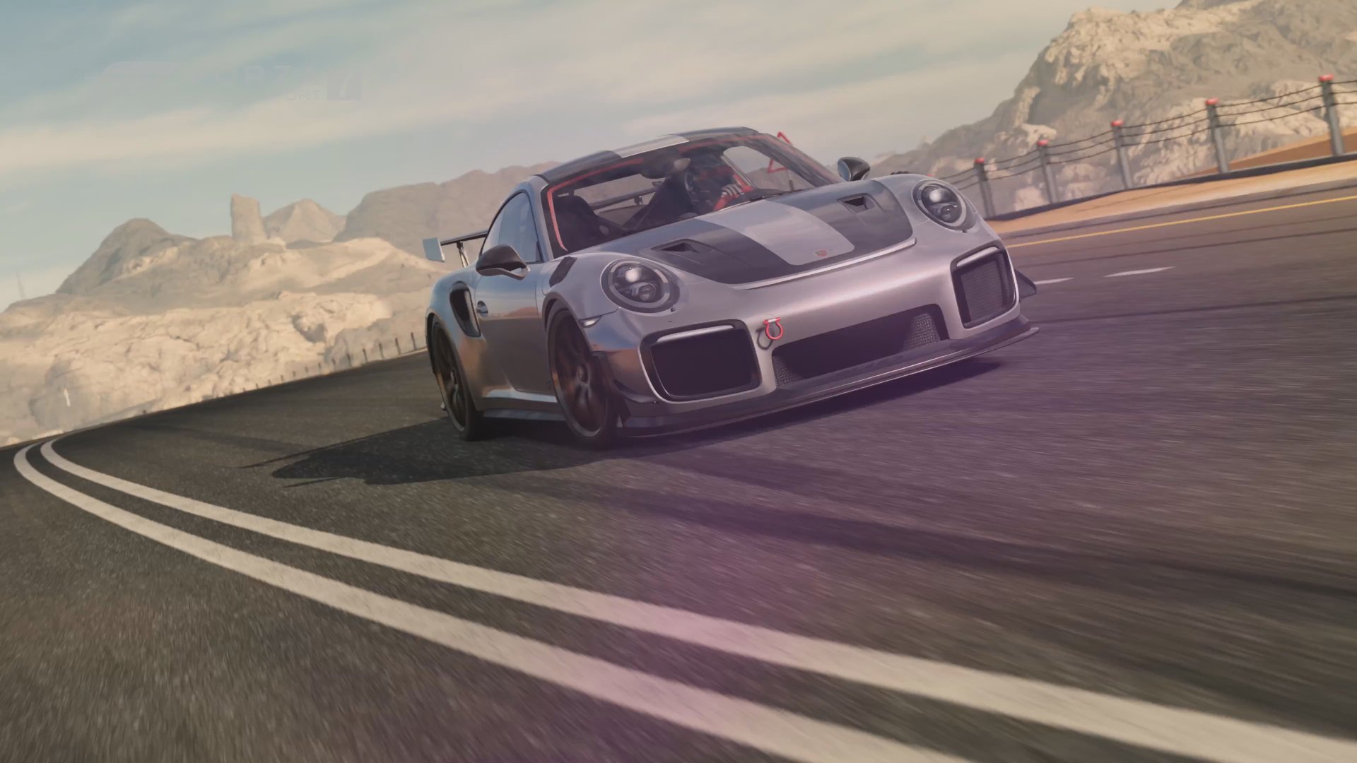Silver Porsche 911 racing on a mountain road in Forza Motorsport 7, captured in 4K Ultra HD for a PC desktop wallpaper.