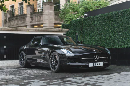 Black Mercedes-Benz SLS AMG parked on a city street, showcased in sharp 4K Ultra HD quality for a striking PC desktop wallpaper and background.