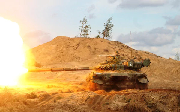 A T-72 tank fires explosively against a rugged landscape, showcasing military power in a striking 4K Ultra HD desktop wallpaper.